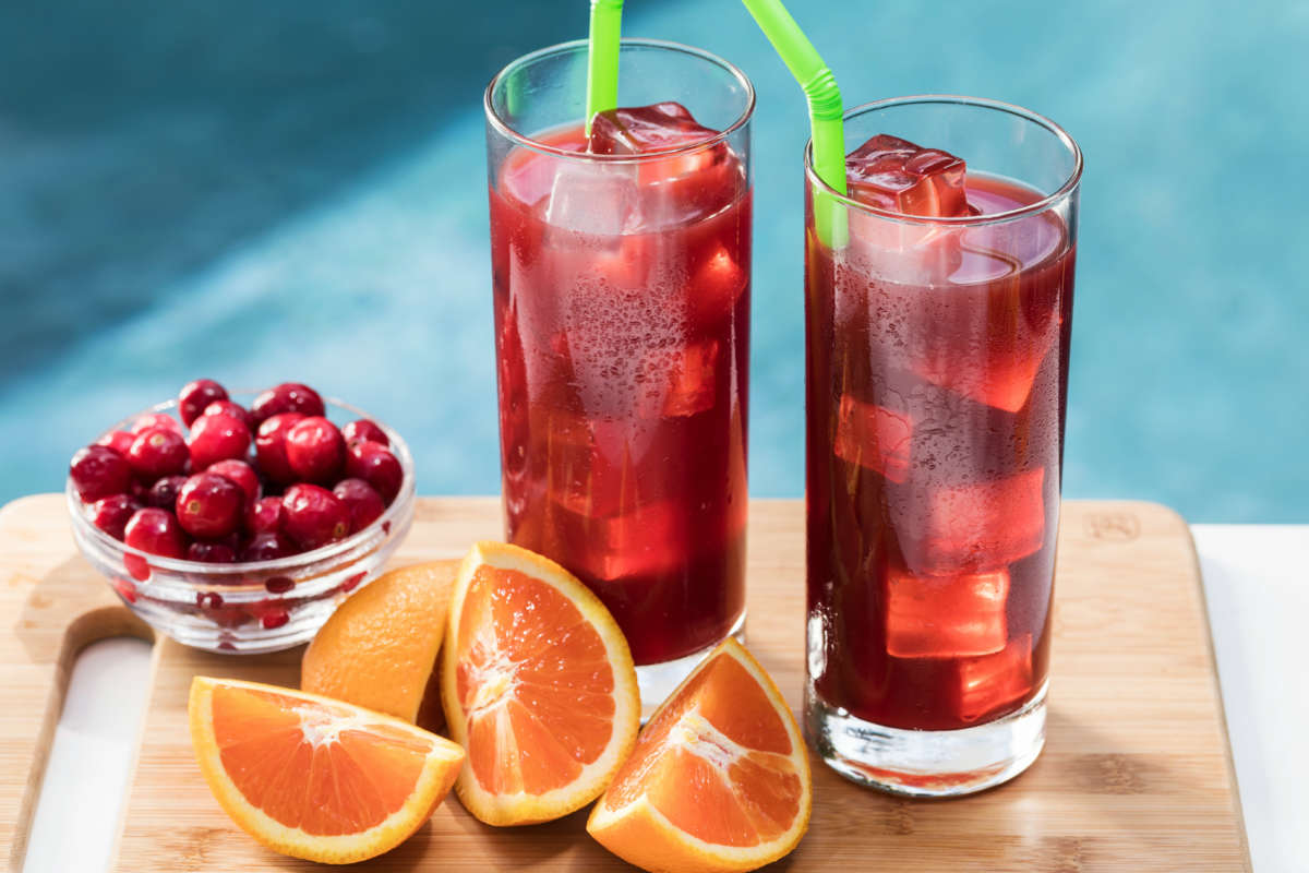 Tall glasses of orange cranberry iced tea