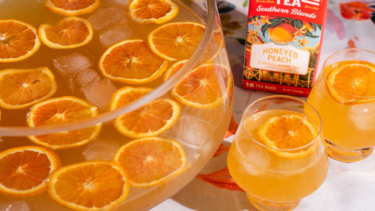 The Imperial Honeyed Peach Party Punch bowl and glasses of punch