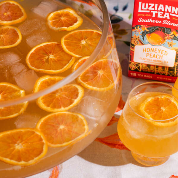 The Imperial Honeyed Peach Party Punch bowl and glasses of punch