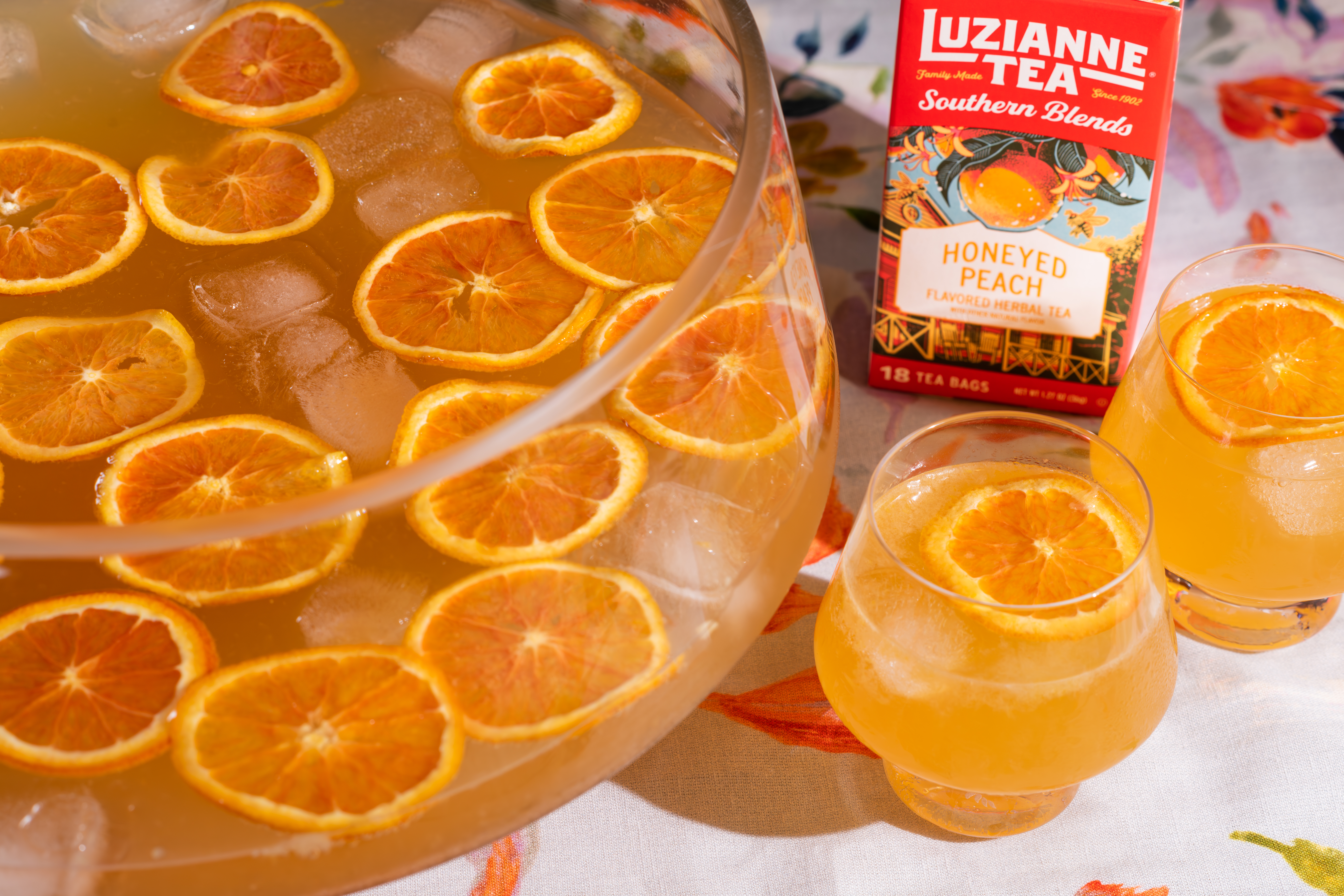 The Imperial Honeyed Peach Party Punch bowl and glasses of punch