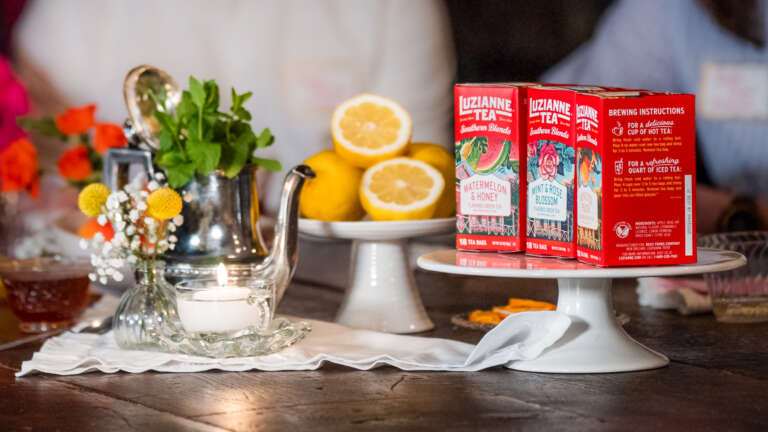 sliver teapot, platter of sliced lemons and 3 boxes of Southern Blends Teas