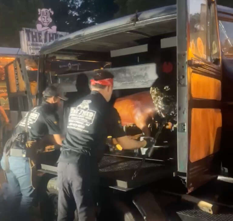 BBQ pit masters of The Shed BBQ restaurant in Mississippi, cooking their prize winning pork at the Memphis in May BBQ contest.