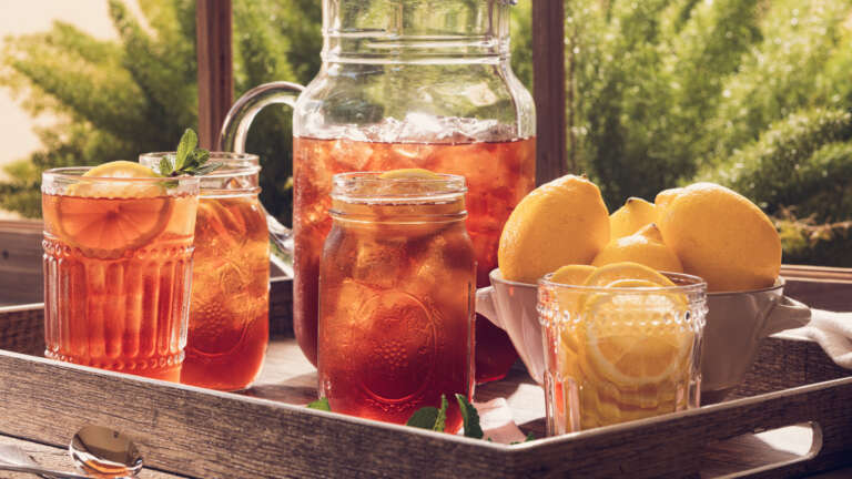 pitcher of ice cold luzianne tea on a tray